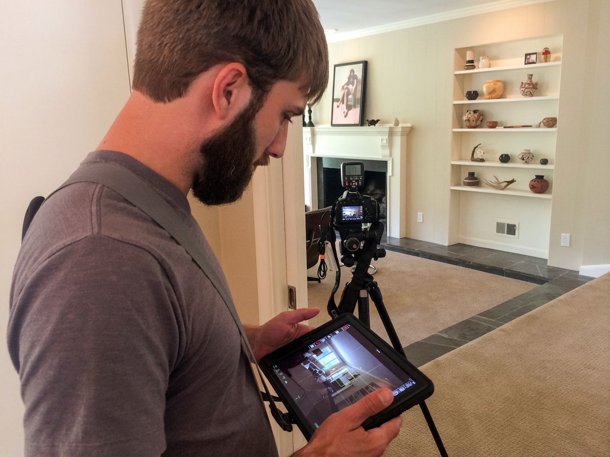 BiziEdit founder shooting a real estate listing with a DSLR and iPad